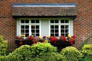 Afbeelding ramen van een woning als beeld bij een blog over woning en pensioenplanning